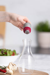 Glass oil bottle with built-in strainer from KILNER, featuring a clear design for easy pouring and filtering oils.