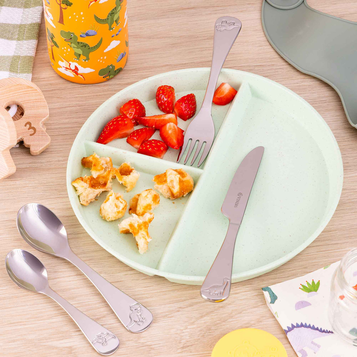Set of three stainless steel children's cutlery by VINERS, including a fork, knife, and spoon for kids.