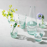 Set of four LSA Mia 250ml recycled glass tumblers with optically designed patterns, perfect for stylish drinking.
