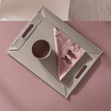 Freeform Duo tablet tray in white and taupe with a sleek, modern design, featuring two compartments for organizing essentials.