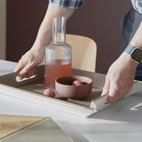 FREEFORM DUO tablet in white and taupe with a sleek, modern design, featuring a smooth surface and rounded edges.