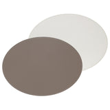 FREEFORM Platzset DUO in taupe and white, oval-shaped table placemats set for elegant dining, featuring a stylish design.