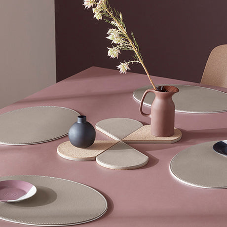 FREEFORM DUO oval placemat set in taupe and white, featuring two elegant, oval-shaped placemats for table setting decor.