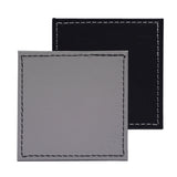 Set of four FREEFORM DUO coasters with modern design, made of durable material, perfect for protecting surfaces from drinks.