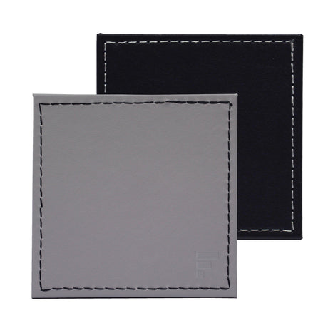 Set of four FREEFORM DUO coasters with modern design, made of durable material, perfect for protecting surfaces from drinks.