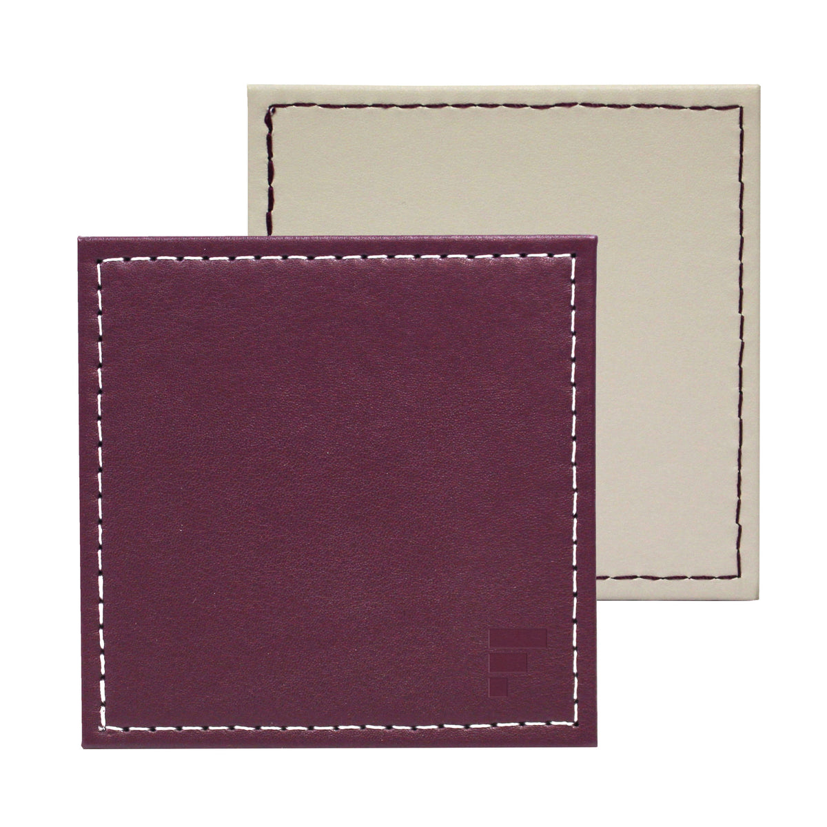 Set of four FREEFORM DUO coasters with modern design, made of durable material, perfect for protecting surfaces from drink condensation.