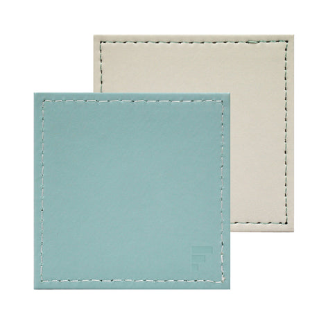 Set of four FREEFORM DUO coasters with modern design, made of durable material, perfect for protecting surfaces from drink spills.