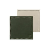 Set of four FREEFORM DUO coasters with modern geometric design, made from durable material, ideal for protecting surfaces.