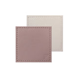 Set of four FREEFORM DUO coasters with modern design, made of durable material, perfect for protecting surfaces from drinks.