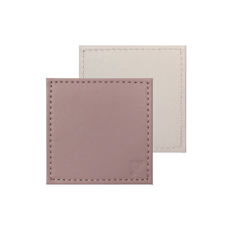 Set of four FREEFORM DUO coasters with modern design, made of durable material, perfect for protecting surfaces from drinks.