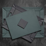FREEFORM Platzset DUO in petrol and anthracite, rectangular table setting with modern design, featuring two coordinating placemats.