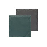 Set of four FREEFORM DUO coasters with modern design, made of durable material, perfect for protecting surfaces from drink spills.