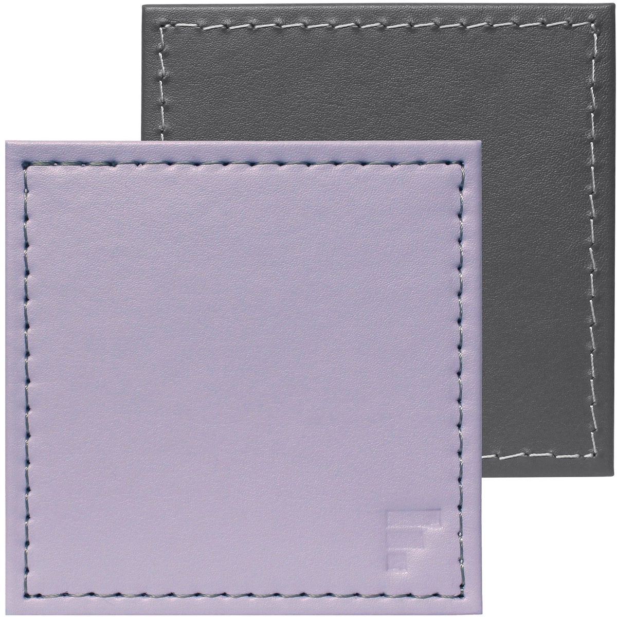 FREEFORM DUO 4-piece coaster set with stylish, durable cork and silicone design, perfect for protecting surfaces from hot or cold drinks.
