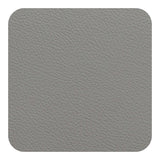 FREEFORM FLEXI glass coaster with flexible silicone edges and transparent center, designed to protect surfaces from heat and moisture.