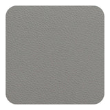 FREEFORM FLEXI glass coaster showing a transparent, flexible silicone surface with a sleek round design on a wooden table.