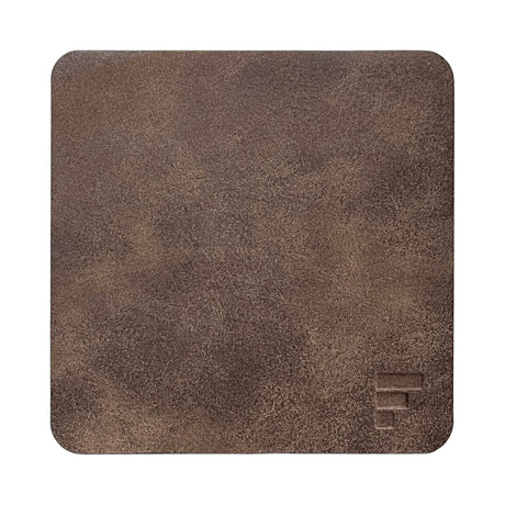 FREEFORM FLEXI leather-look coaster set with four round drink coasters on a wooden table.