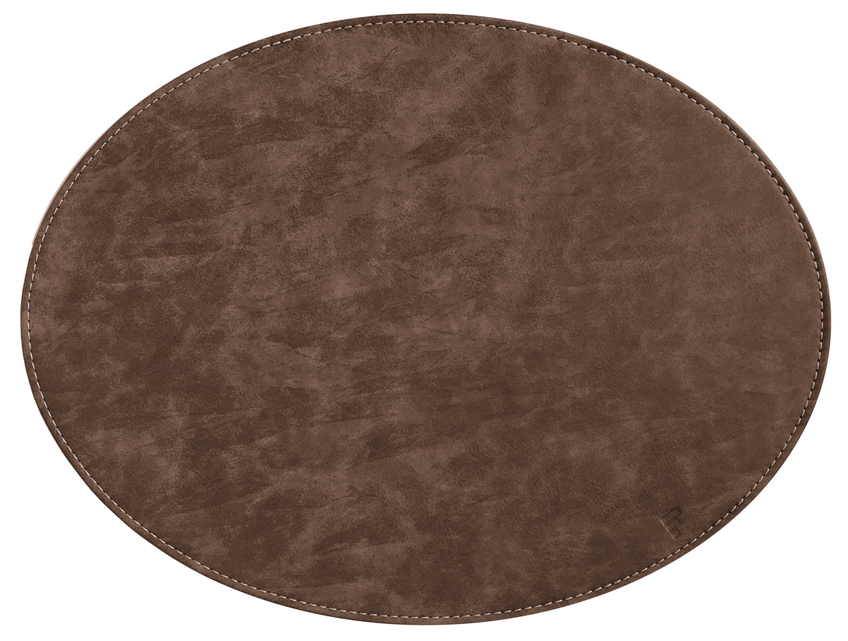 Oval FREEFORM textile table placemat with leather-look finish, ideal for stylish dining and table setting decor.