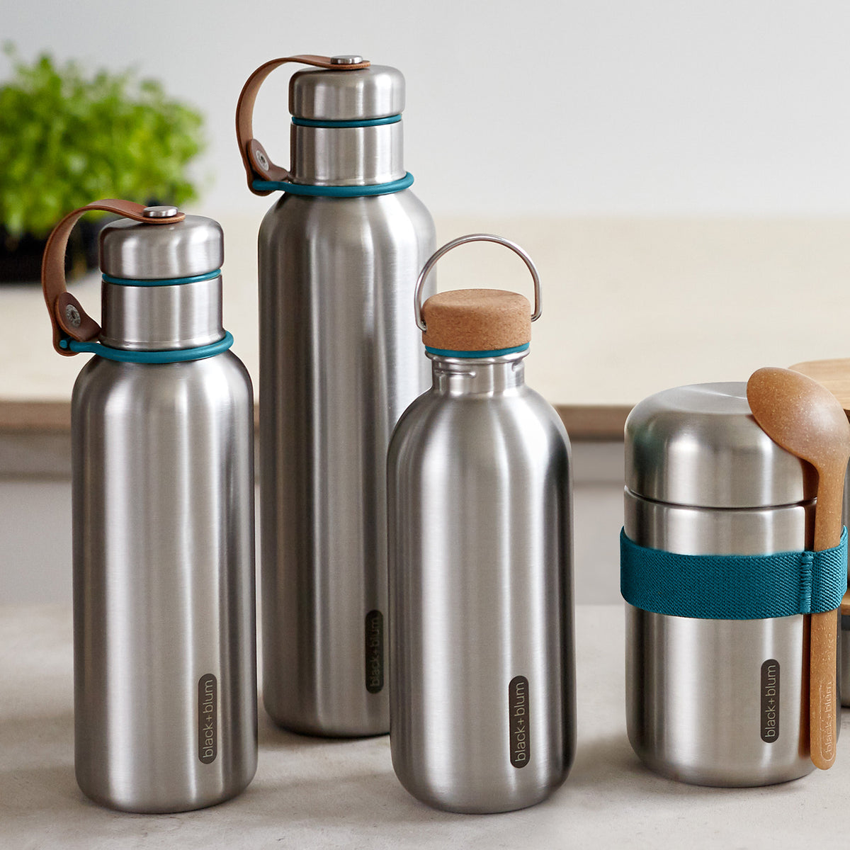 Black+Blum Classic 600ml reusable water bottle with black screw-on cap, made from stainless steel, on white background.