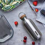 BLACK+BLUM Classic 600ml reusable water bottle with black cap and sleek design for daily hydration.