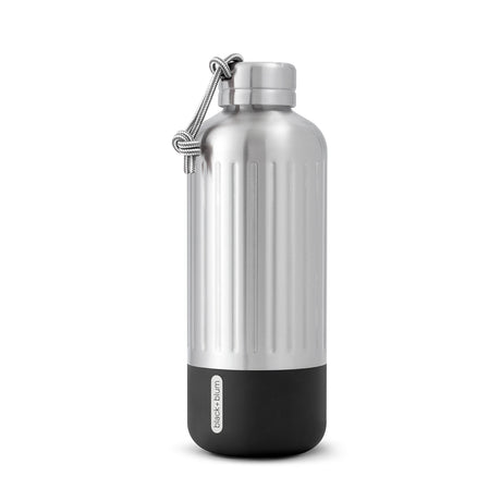 BLACK+BLUM Explorer insulated flask in vibrant orange with a sleek stainless steel body and black screw-on lid.