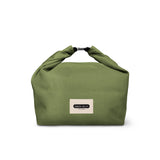 BLACK+BLUM lunchbag with black exterior and zipper closure, showing a compact design for carrying meals and snacks.
