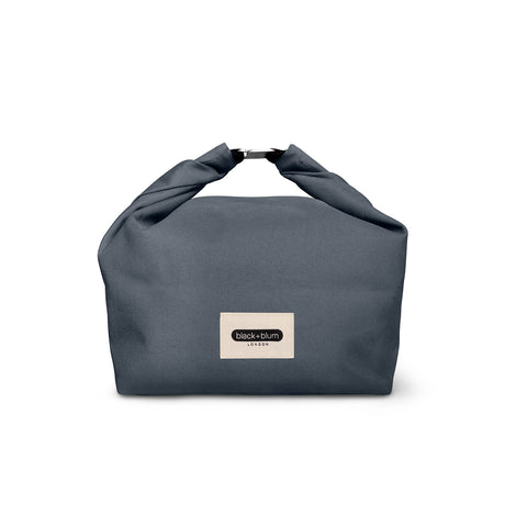 BLACK+BLUM lunchbag in black with a 6.7-liter capacity, featuring a sleek, compact design for carrying meals conveniently.