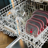 Set of four BLACK+BLUM glass multifunction storage boxes with lids, ideal for kitchen organization and food storage.