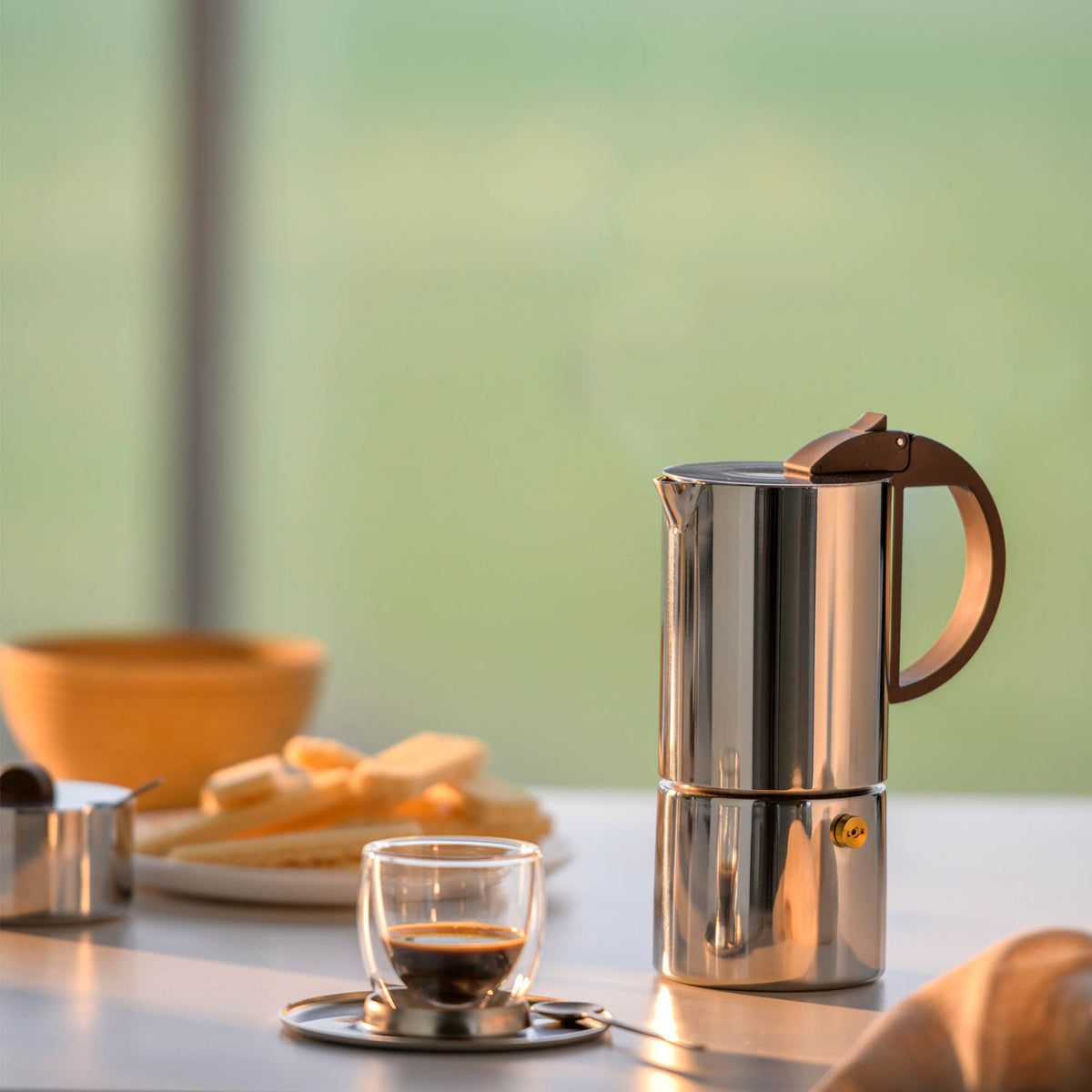 GNALI & ZANI Chicca espresso maker, stovetop espresso pot in sleek stainless steel with black handle, ready for brewing coffee.