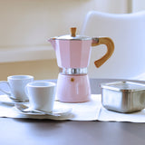 Pink GNALI & ZANI Venezia espresso maker with a classic stovetop design and polished metal finish.