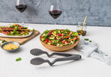 Black DREAMFARM Küchenzange with CLONGS handle, stainless steel tongs for cooking and serving.