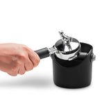 DREAMFARM Kaffeesatz-Behälter for coffee grounds storage, compact container with lid, in a modern kitchen setting