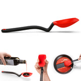 DREAMFARM 3-in-1 Kochlöffel (Spoon) with ergonomic handle, versatile design for cooking and stirring in the kitchen.
