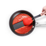 DREAMFARM 3-in-1 Kochlöffel (Spoon) in stainless steel with ergonomic handle, perfect for cooking and stirring.