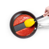 DREAMFARM 3-in-1 Kochlöffel (Spoon) with ergonomic handle and versatile design for stirring and serving in the kitchen.