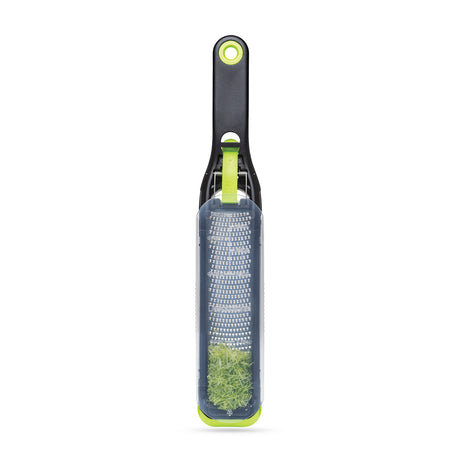 DREAMFARM fine and concave kitchen grater in green with three sides for versatile food grating and zesting.
