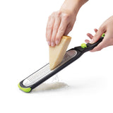 DREAMFARM fine and concave kitchen grater in green with three sides, ideal for zesting and grating in the kitchen.