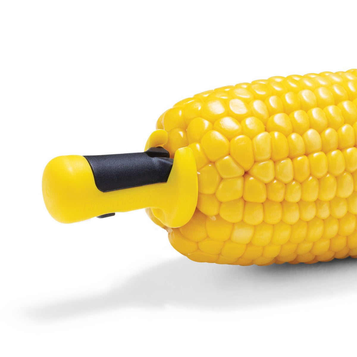 DREAMFARM yellow four-piece corn holder set with locking clips for easy handling of corn on the cob.
