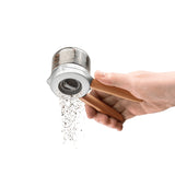 DREAMFARM ORTWO black spice grinder with a sleek design and textured grip for easy seasoning.