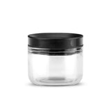 DREAMFARM ORTWO black spice grinder with a sleek modern design, showing the grinder's ceramic grinding mechanism.
