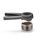 DREAMFARM ORTWO black spice grinder with a sleek modern design and adjustable ceramic grinding mechanism.