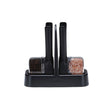 DREAMFARM ORTWO Lite black spice grinder set with two sleek, modern salt and pepper mills on a wooden surface.