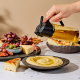 Black DREAMFARM Ölsprüh-Flasche OILEROO for oil spraying, 400ml capacity, with a sleek design and ergonomic spray nozzle.