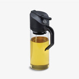 DREAMFARM Oileroo black oil spray bottle, 400ml, with spray nozzle, designed for easy oil application, shown in the image.