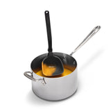 Red DREAMFARM Schöpfkelle (ladle) for cooking, with a sturdy handle and deep bowl, ideal for serving soups and liquids.