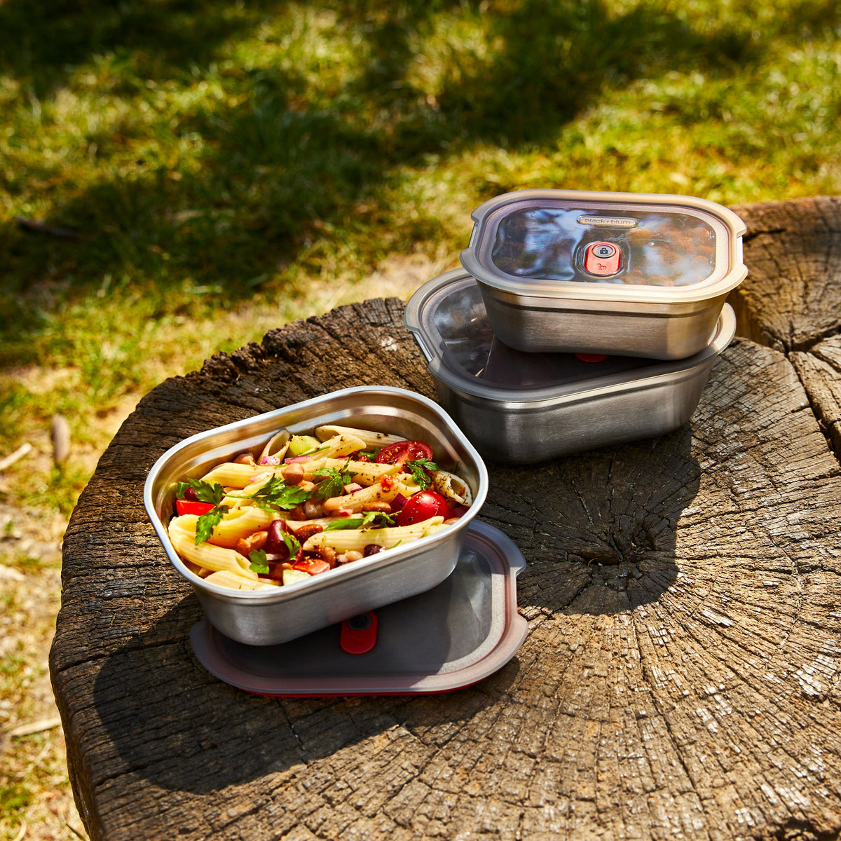 BLACK+BLUM stainless steel multifunction storage containers in a set of three, rectangular shape with lids.