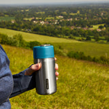 BLACK+BLUM TO-GO insulated thermobecher in orange with a secure lid, ideal for travel and keeping beverages hot or cold.