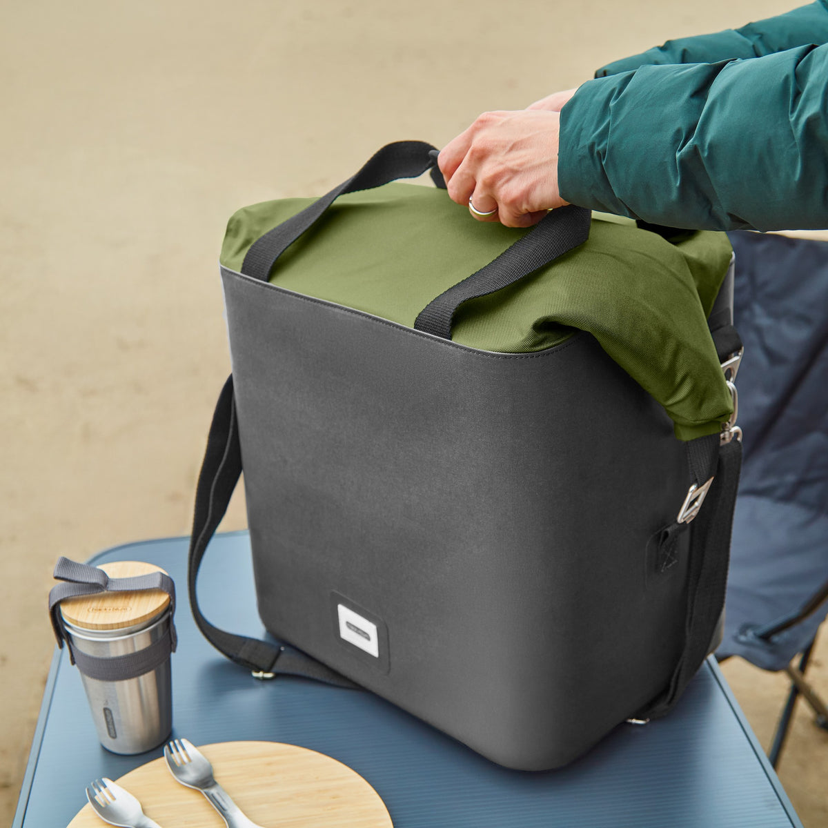 Black+Blum insulated cooler bag in moss green, foldable, perfect for picnics and outdoor food storage.