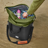 Black+Blum insulated cooler bag, foldable and moss green, shown open with interior storage for snacks and beverages.