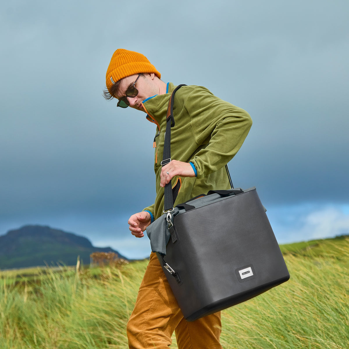Black+Blum insulated cooler bag in slate with shoulder strap, foldable design, ideal for picnics and outdoor use