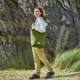 BLACK+BLUM insulated picnic tote bag in moss green with sturdy handles, ideal for outdoor outings and food transport.